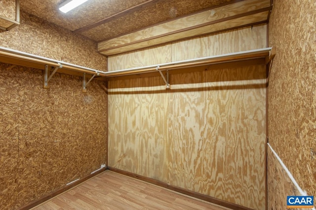 spacious closet with wood finished floors