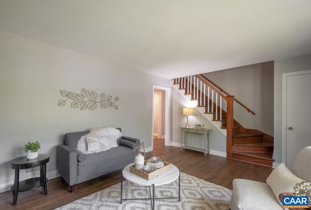 living area featuring stairway, wood finished floors, and baseboards