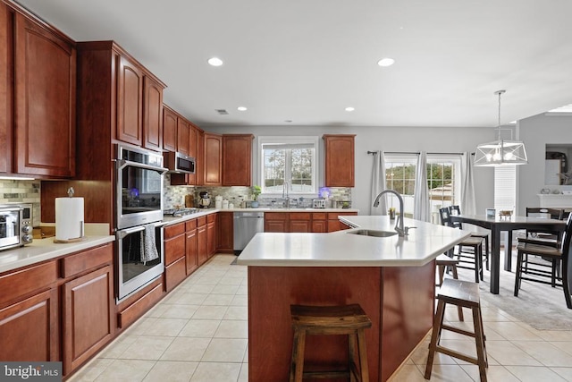 10314 Limestone Ave, Culpeper, VA 22701 - kitchen featuring a sink, appliances with stainless steel finishes, light tile patterned floors, light countertops, and recessed lighting