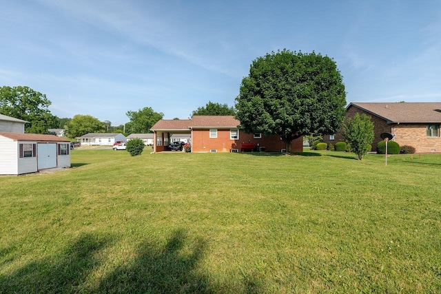 205 Lewis Ave, Elkton, VA 22827 - view of green lawn featuring a storage unit