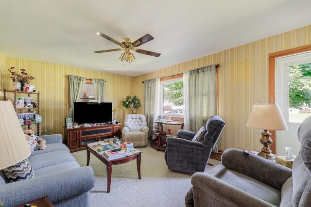 205 Lewis Ave, Elkton, VA 22827 - carpeted living room featuring a ceiling fan and wallpapered walls