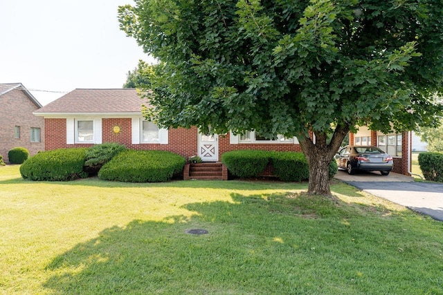 205 Lewis Ave, Elkton, VA 22827 - view of front of property with brick siding, a front yard, and driveway