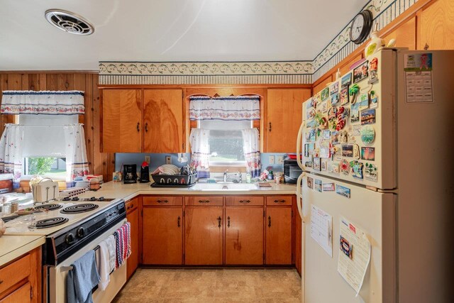 205 Lewis Ave, Elkton, VA 22827 - kitchen featuring white appliances, light countertops, and healthy amount of natural light