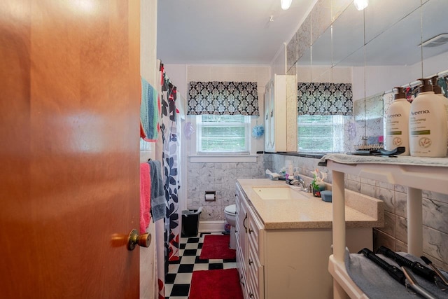 205 Lewis Ave, Elkton, VA 22827 - bathroom with tile patterned floors, tile walls, vanity, and curtained shower