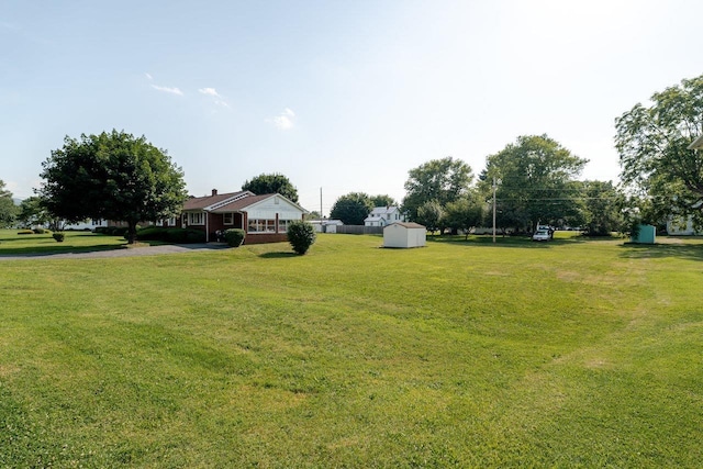 205 Lewis Ave, Elkton, VA 22827 - view of grassy yard with a shed