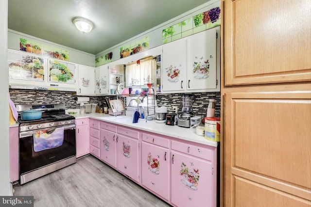 526 Azalea St, Culpeper, VA 22701 - kitchen featuring stainless steel gas range oven, decorative backsplash, and light countertops