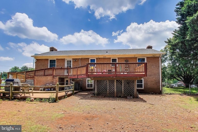 526 Azalea St, Culpeper, VA 22701 - back of house with a chimney, brick siding, and a wooden deck