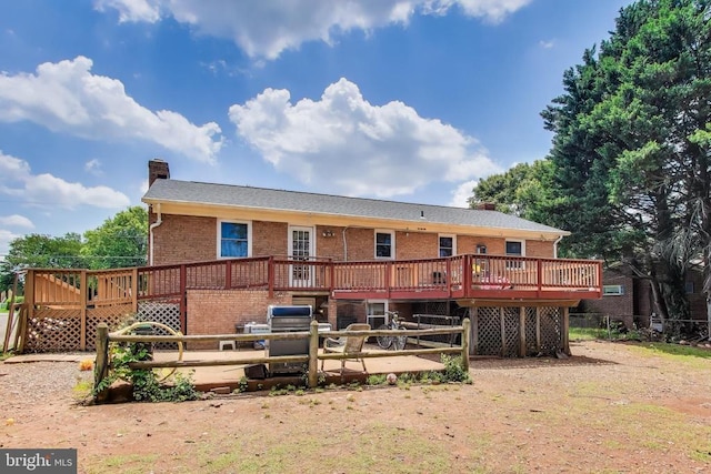 526 Azalea St, Culpeper, VA 22701 - back of house featuring a chimney, a deck, and brick siding
