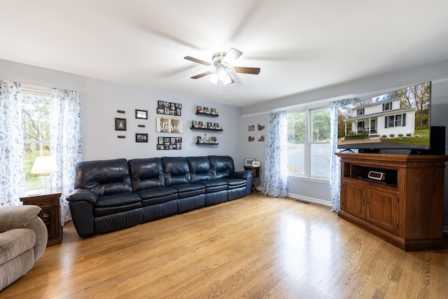 153 Heritage Hill Ln, Rochelle, VA 22738 - living room with a ceiling fan, baseboards, light wood finished floors, and visible vents