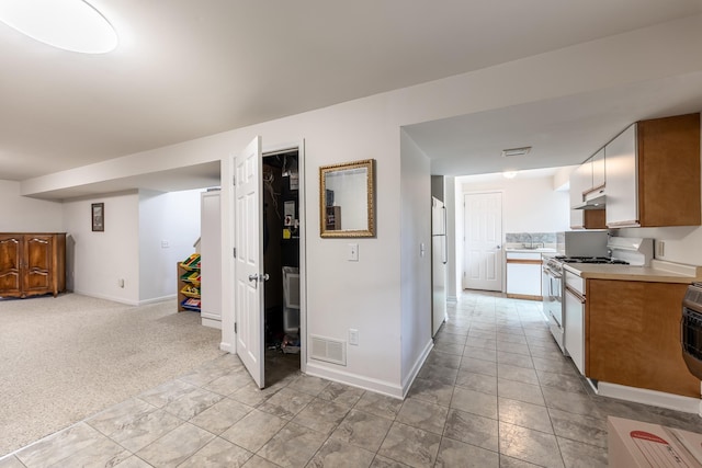 153 Heritage Hill Ln, Rochelle, VA 22738 - kitchen featuring freestanding refrigerator, baseboards, gas stove, visible vents, and light countertops