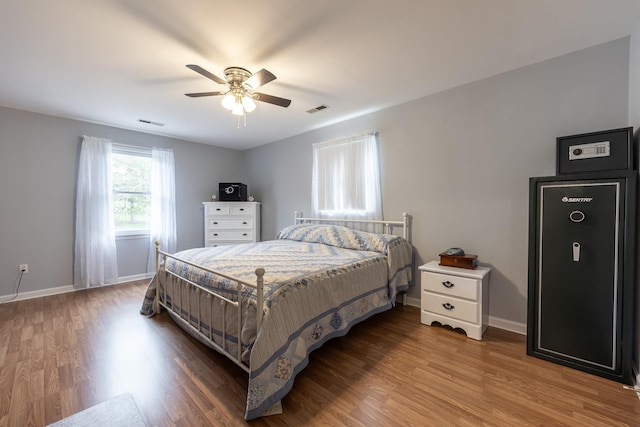 153 Heritage Hill Ln, Rochelle, VA 22738 - bedroom with a ceiling fan, visible vents, wood finished floors, and baseboards