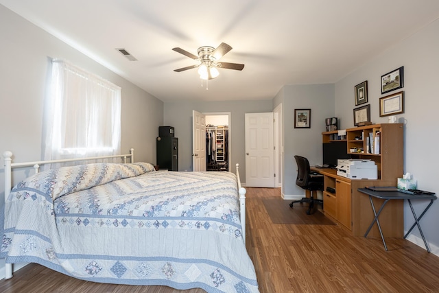 153 Heritage Hill Ln, Rochelle, VA 22738 - bedroom with a closet, baseboards, ceiling fan, a walk in closet, and wood finished floors
