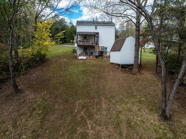 153 Heritage Hill Ln, Rochelle, VA 22738 - back of house with a lawn, a deck, an outbuilding, and a storage unit