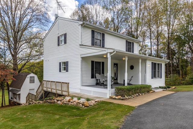 153 Heritage Hill Ln, Rochelle, VA 22738 - view of front facade featuring a storage shed, an outdoor structure, covered porch, and a front yard