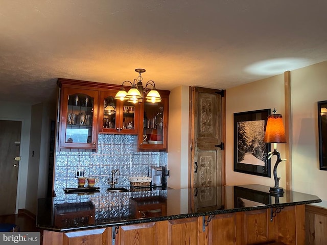 203 Timbers, Timbers, VA 22967 - bar featuring tasteful backsplash, hanging light fixtures, and a chandelier