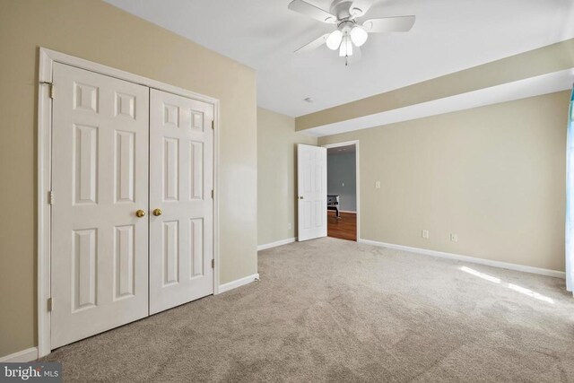 203 Birdie Rd, Locust Grove, VA 22508 - unfurnished bedroom with carpet floors, baseboards, a closet, and a ceiling fan