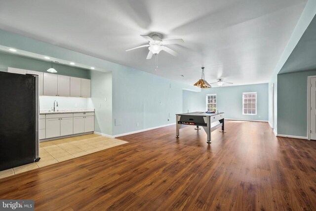 203 Birdie Rd, Locust Grove, VA 22508 - rec room featuring ceiling fan, light wood-type flooring, a sink, and baseboards