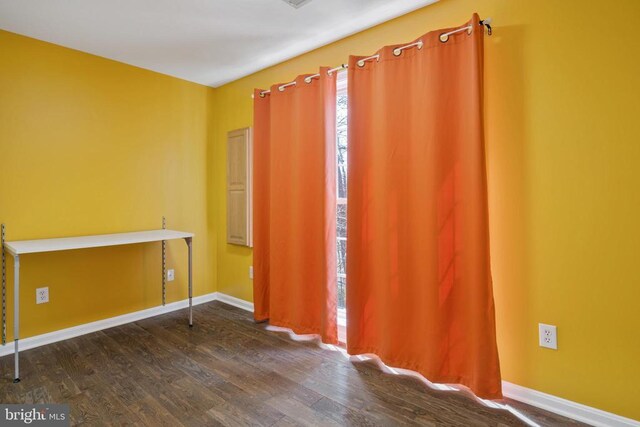 203 Birdie Rd, Locust Grove, VA 22508 - spare room featuring dark wood-type flooring and baseboards
