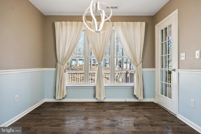 203 Birdie Rd, Locust Grove, VA 22508 - unfurnished dining area featuring wood finished floors, a chandelier, and baseboards