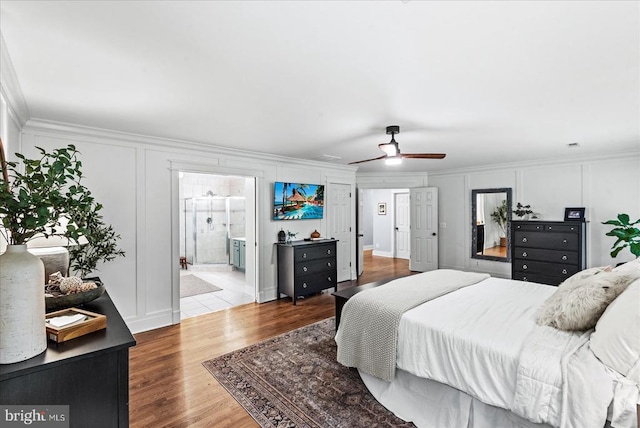 13515 Perimeter Dr, Fredericksburg, VA 22407 - bedroom with crown molding, wood finished floors, a decorative wall, and ensuite bathroom