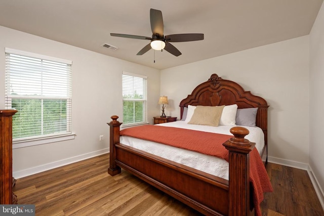  - bedroom featuring baseboards, wood finished floors, and a ceiling fan