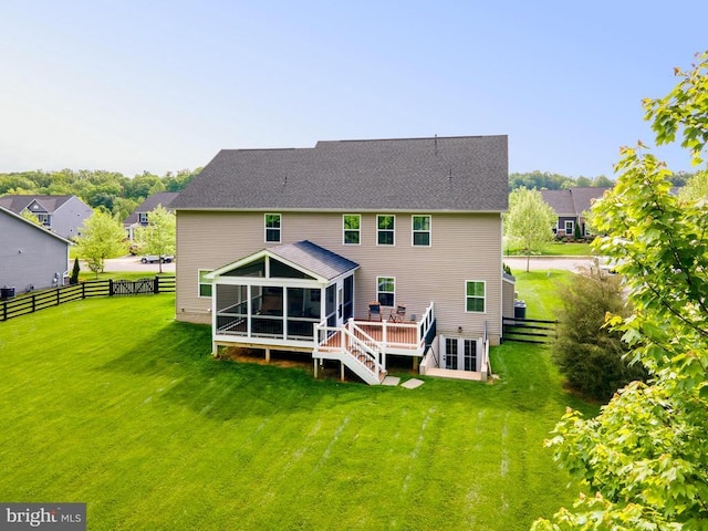  - rear view of house featuring a sunroom, a deck, and stairs