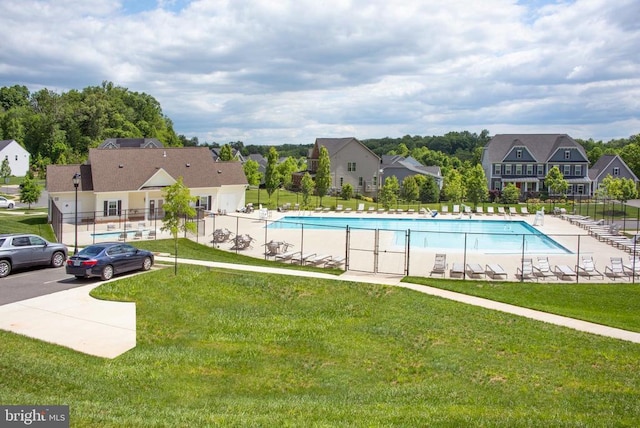  - community pool featuring a residential view