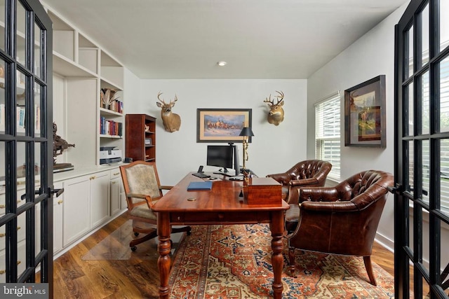  - home office with plenty of natural light and wood finished floors