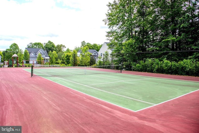  - view of tennis court featuring community basketball court