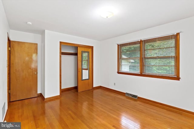 5524 Hickory Ridge Rd, Spotsylvania, VA 22551 - unfurnished bedroom featuring wood finished floors, a closet, and baseboards