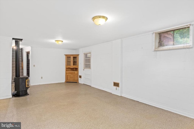 5524 Hickory Ridge Rd, Spotsylvania, VA 22551 - below grade area featuring a wood stove and baseboards