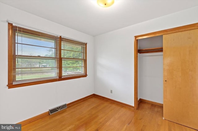 5524 Hickory Ridge Rd, Spotsylvania, VA 22551 - unfurnished bedroom featuring a closet, light wood finished floors, and baseboards