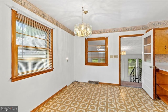 5524 Hickory Ridge Rd, Spotsylvania, VA 22551 - spare room with a chandelier and baseboards
