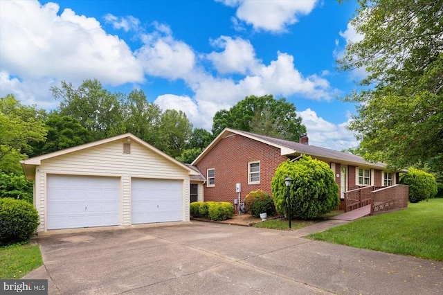 5524 Hickory Ridge Rd, Spotsylvania, VA 22551 - view of side of home with brick siding, a garage, an outdoor structure, and a chimney