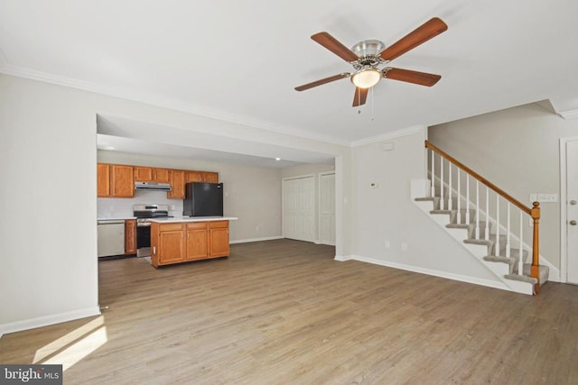 1132 Amber Ridge Rd, Charlottesville, VA 22901 - unfurnished living room featuring ornamental molding, light wood-style flooring, stairway, and a ceiling fan