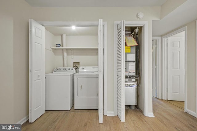 1132 Amber Ridge Rd, Charlottesville, VA 22901 - washroom featuring separate washer and dryer and light wood-style flooring