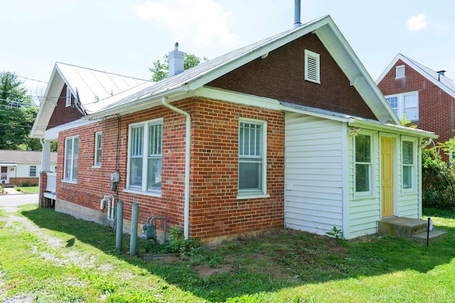 126 Park Blvd, Staunton, VA 24401 - view of property exterior featuring a chimney, a yard, entry steps, and brick siding