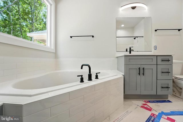 394 Pinehurst Rd, Gordonsville, VA 22942 - full bathroom featuring toilet, vanity, a garden tub, a shower, and marble finish flooring