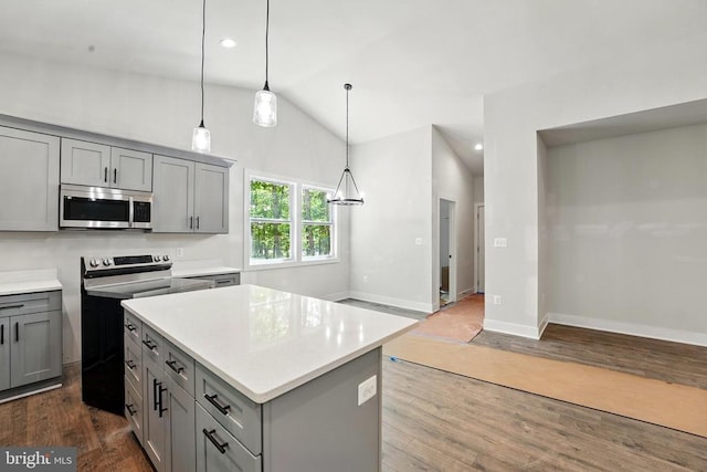 394 Pinehurst Rd, Gordonsville, VA 22942 - kitchen featuring stainless steel microwave, gray cabinetry, vaulted ceiling, dark wood-style flooring, and light countertops