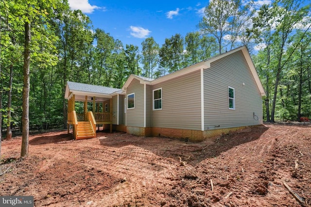 394 Pinehurst Rd, Gordonsville, VA 22942 - view of home's exterior featuring covered porch, ceiling fan, and stairs