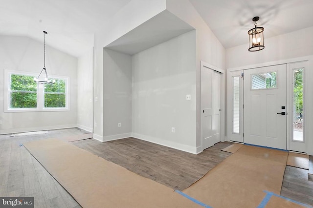 394 Pinehurst Rd, Gordonsville, VA 22942 - entryway with healthy amount of natural light, wood finished floors, vaulted ceiling, and a chandelier