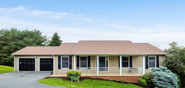 163 Valley View Ave, Mount Sidney, VA 24467 - view of front facade featuring covered porch, a garage, driveway, and roof with shingles