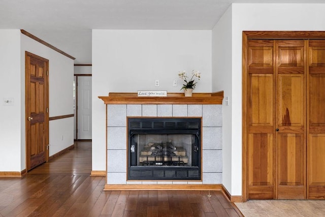 163 Valley View Ave, Mount Sidney, VA 24467 - detailed view of wood finished floors, a tile fireplace, baseboards, and ornamental molding