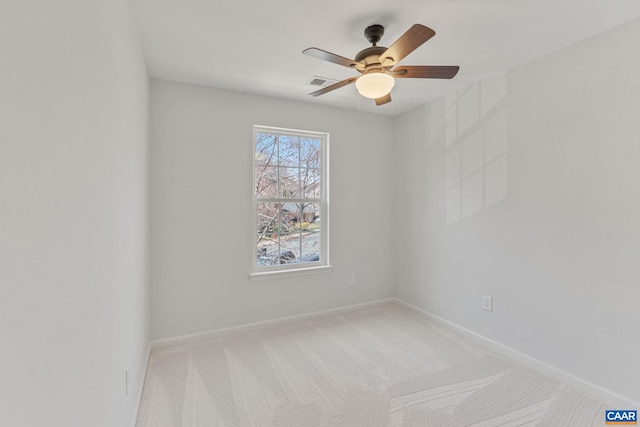 unfurnished room featuring visible vents, baseboards, ceiling fan, and carpet floors