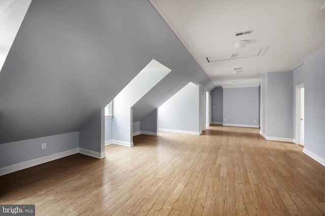  - additional living space featuring wood finished floors and baseboards