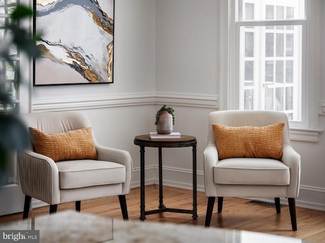  - sitting room with wood finished floors and baseboards