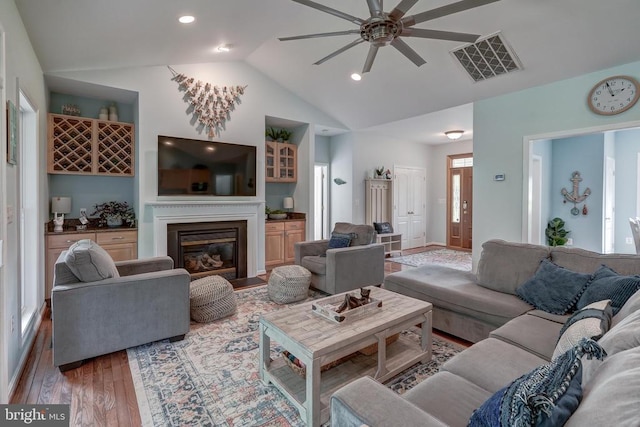 15507 Chestnut Tree Ct, Mineral, VA 23117 - living room with wood finished floors, ceiling fan, vaulted ceiling, a glass covered fireplace, and recessed lighting