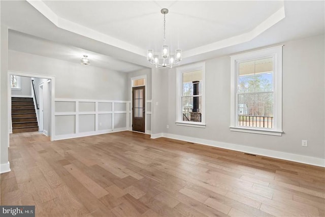 Glenmore Ln Lot 37, Keswick, VA 22947 - unfurnished dining area featuring a raised ceiling, a chandelier, wood finished floors, stairway, and baseboards