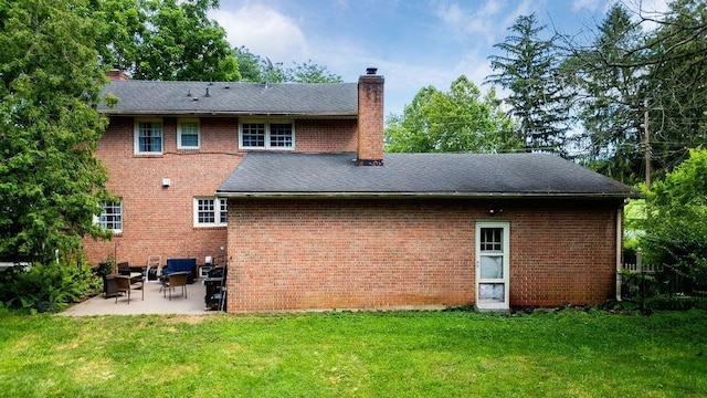 935 Glenwood Blvd, Waynesboro, VA 22980 - back of house with a chimney, a patio, a yard, and brick siding