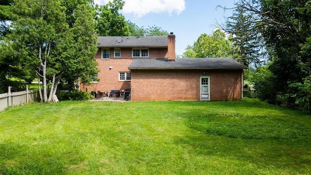 935 Glenwood Blvd, Waynesboro, VA 22980 - back of house with a patio, a chimney, and brick siding